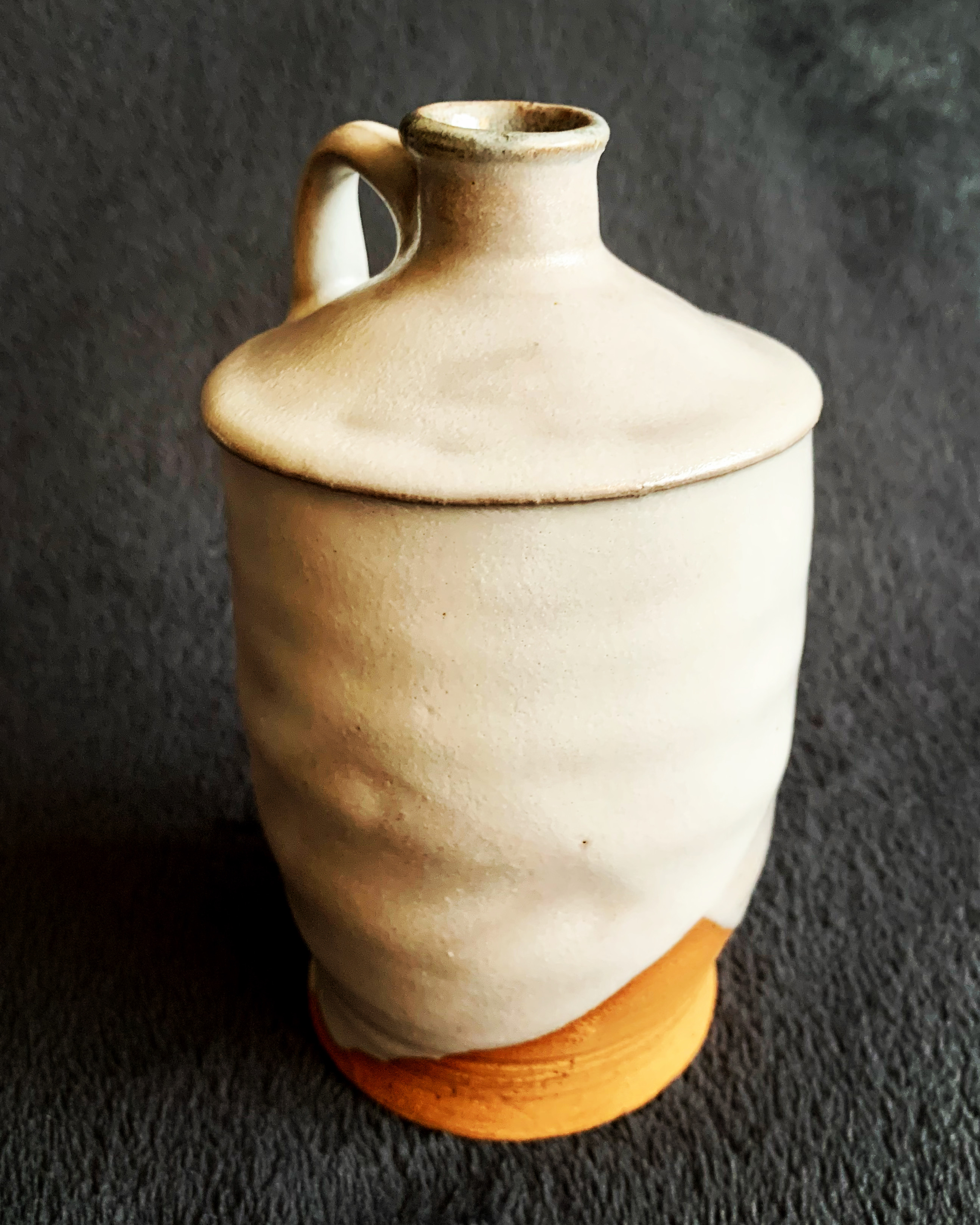 a stack of bowls and a vase